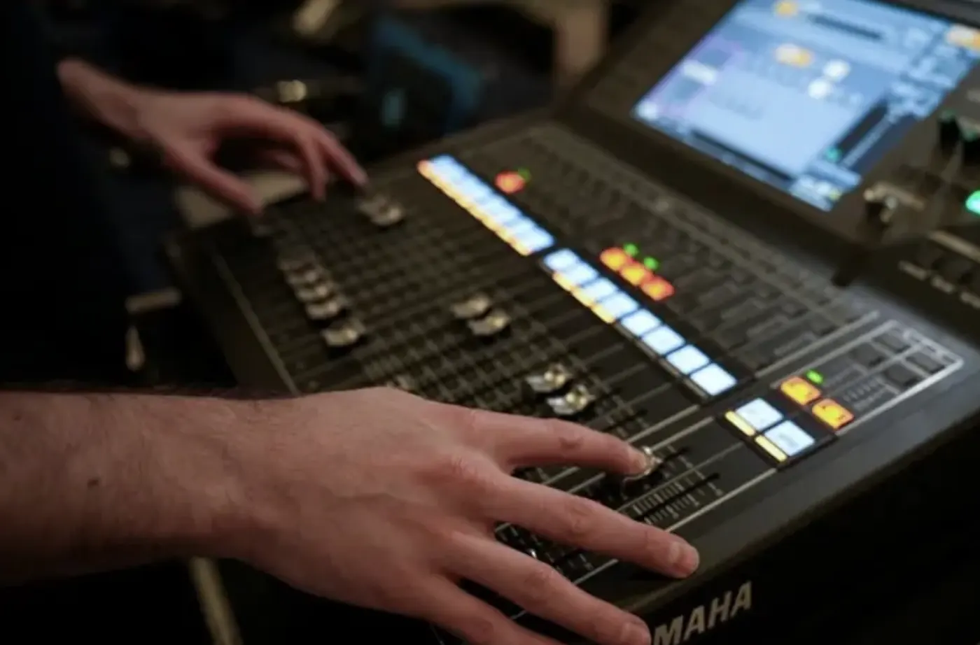SJARK engineer working a Yamaha mixing desk